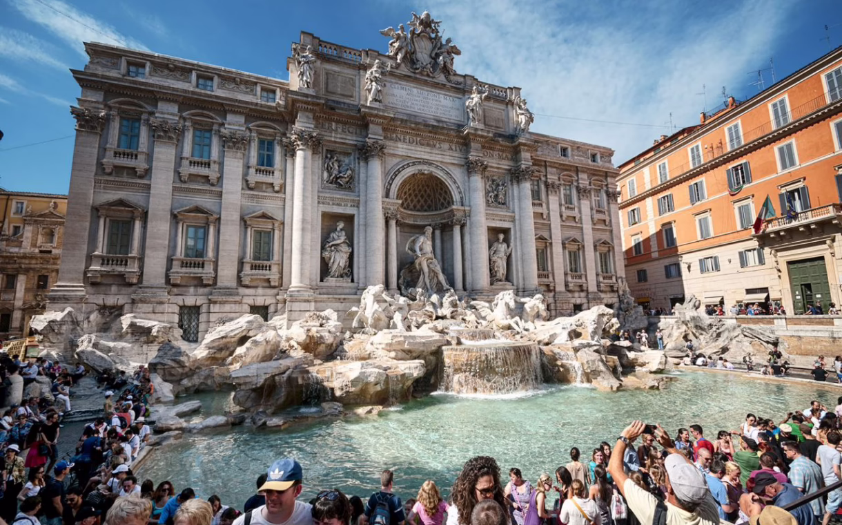 Trevi fountain in Rome, Italy, crowded with tourists