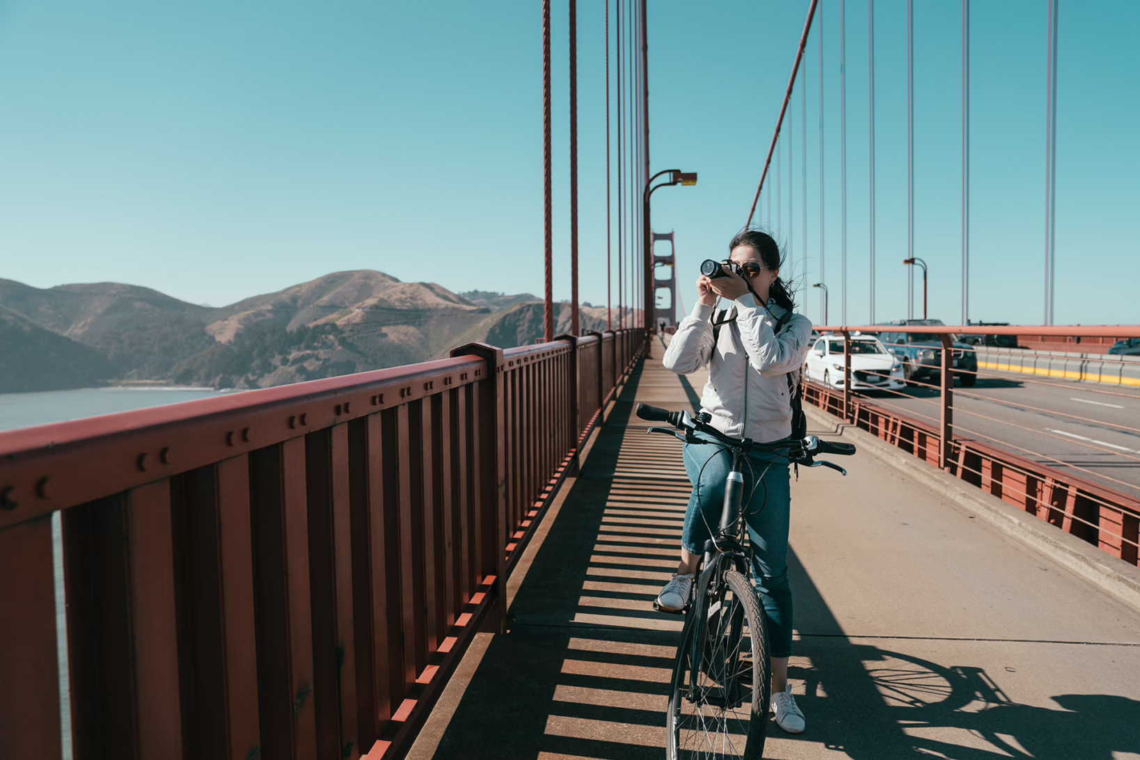 Golden-gate-bridge-biking-lady-sightseeing