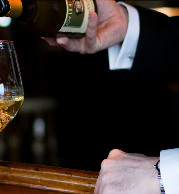 man pouring wine