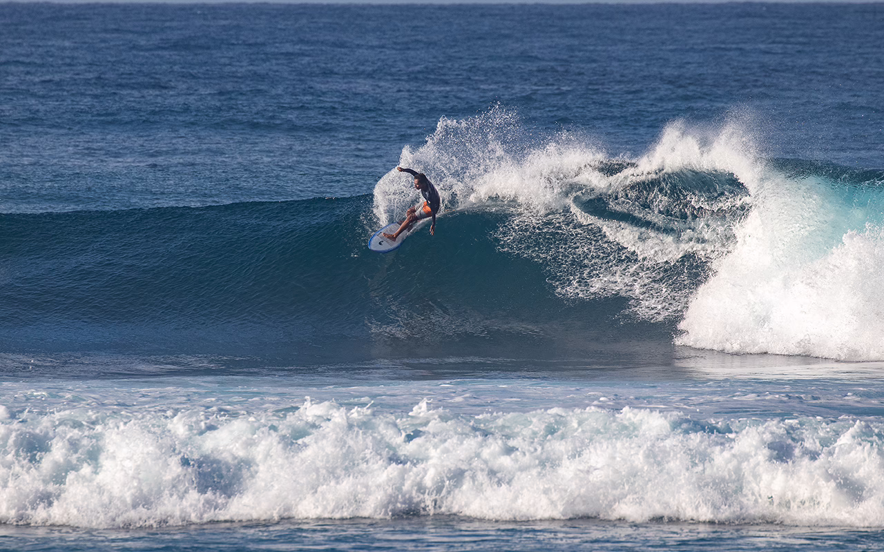Padang Padang Surf Camp surfer on waves