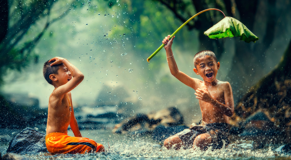 Children playing in the river in Cambodia