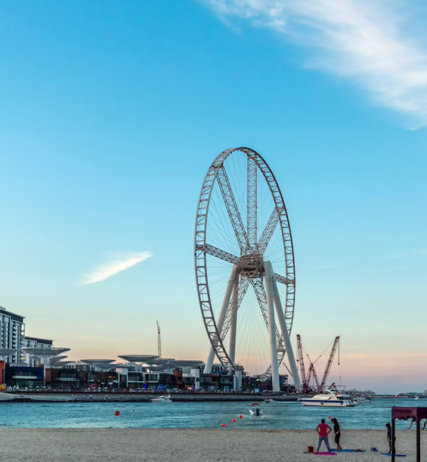 open beach ferris wheel blue sky