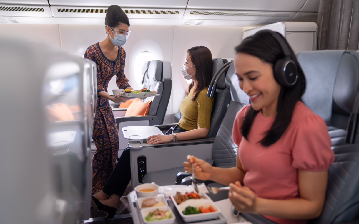 asian eating inside plane