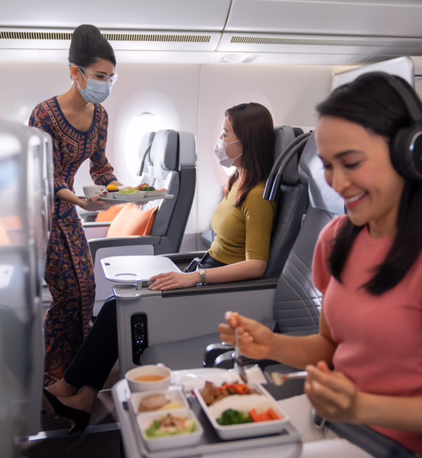asian eating inside plane