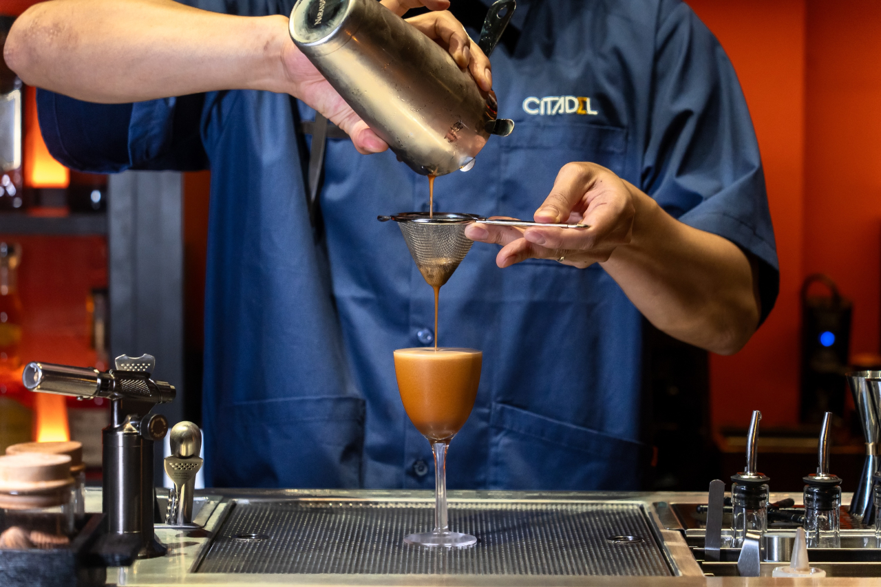 bartender making an espresso martini drink