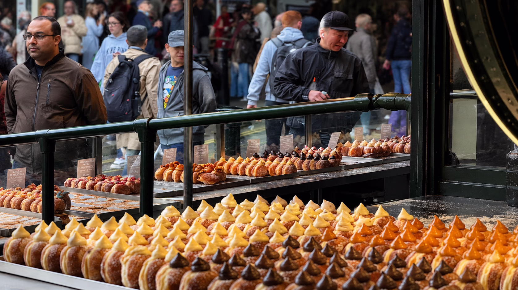 Rows of freshly filled doughnuts at Bread Ahead.