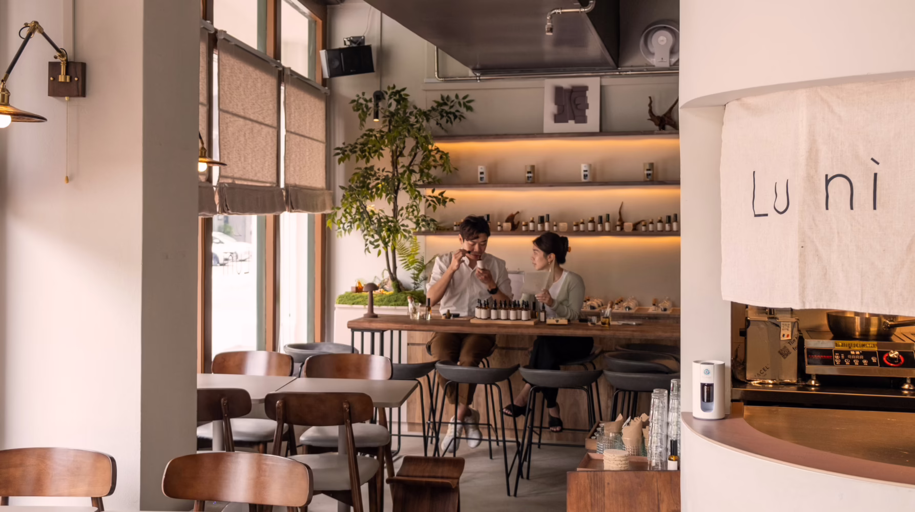 Guests participating in a scent or cocktail workshop at Lunì in Singapore