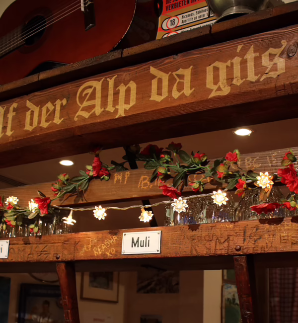 Warm timber interior of Aelpli Bar in Zurich.