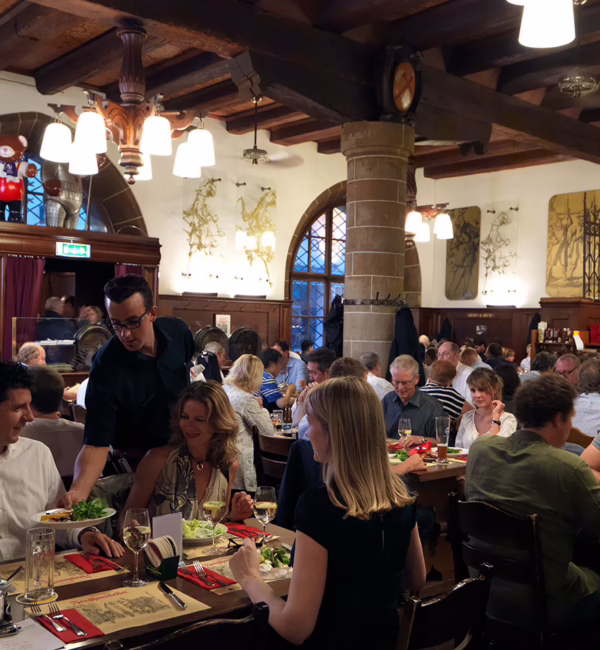 Bustling dining room inside Zeughauskeller in Zurich