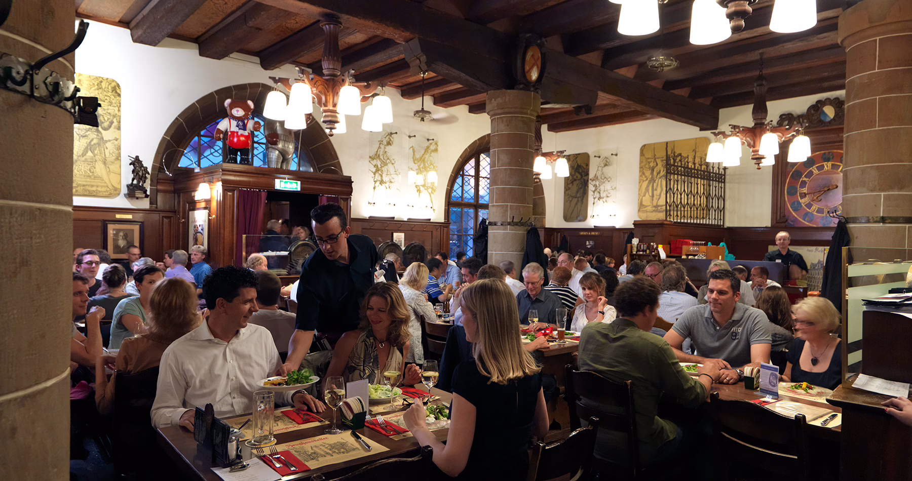 Bustling dining room inside Zeughauskeller in Zurich