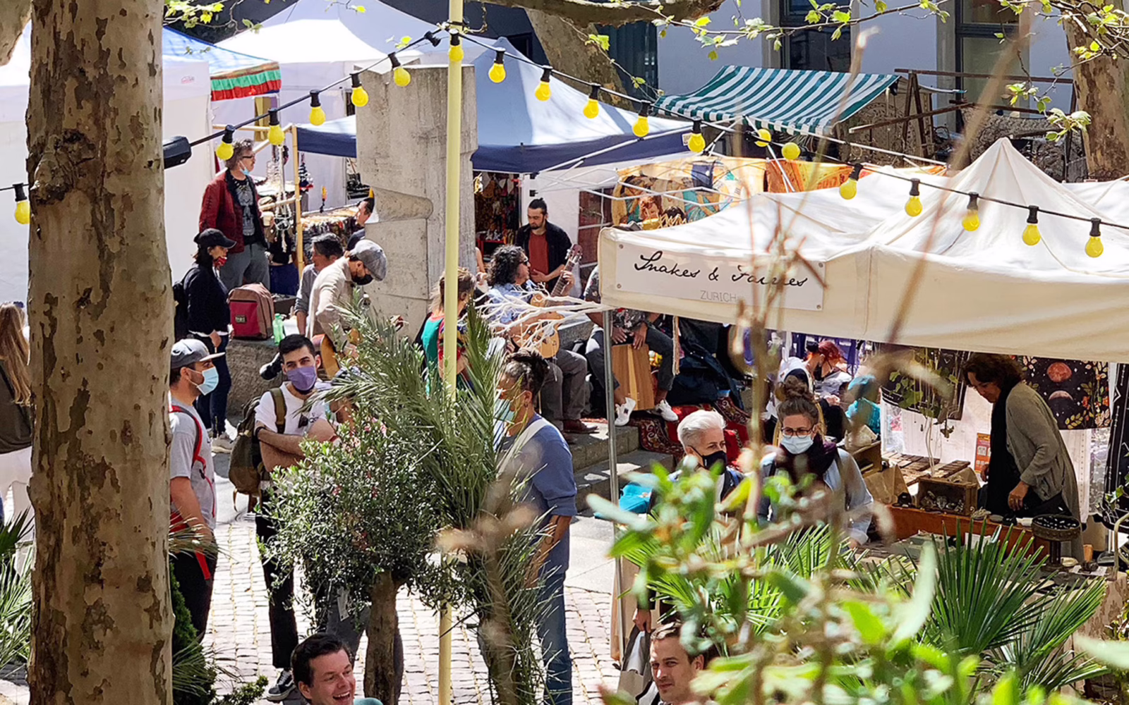 Stalls selling handcrafted jewellery, ceramics, textiles and souvenirs at Rosenhof Market in Zurich’s Old Town.