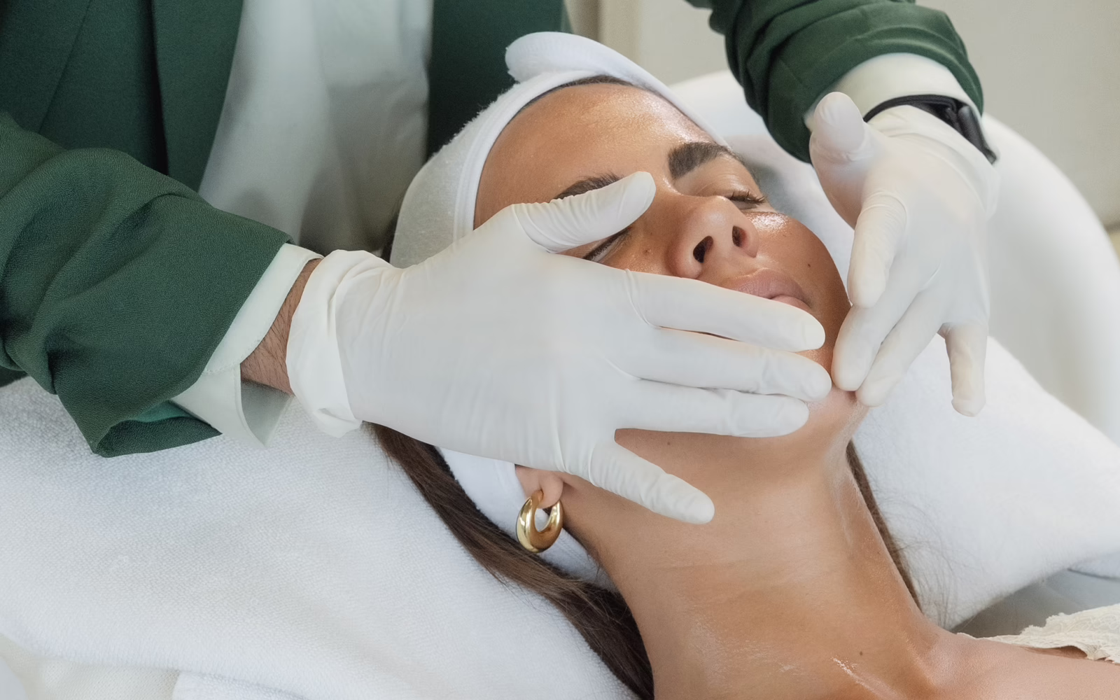 Guest receiving a facial treatment at SŌMA Aesthetics & Longevity Club in Bali
