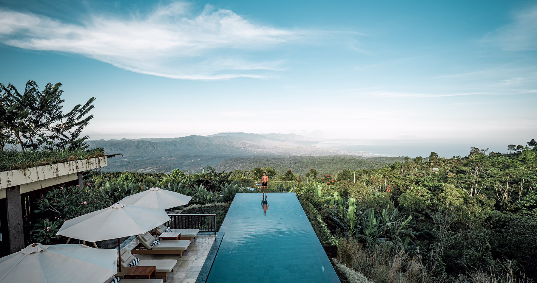 Infinity pool at Munduk Moding Plantation Nature Resort overlooking the mountains and Java Sea in North Bali.