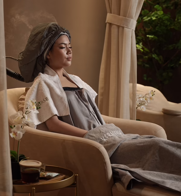 A client receives a Kérastase hair treatment at May May Salon in Jakarta