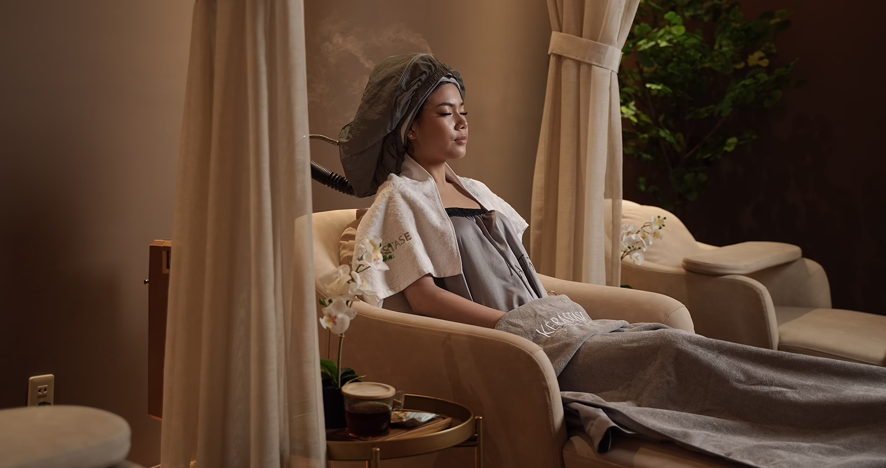 A client receives a Kérastase hair treatment at May May Salon in Jakarta