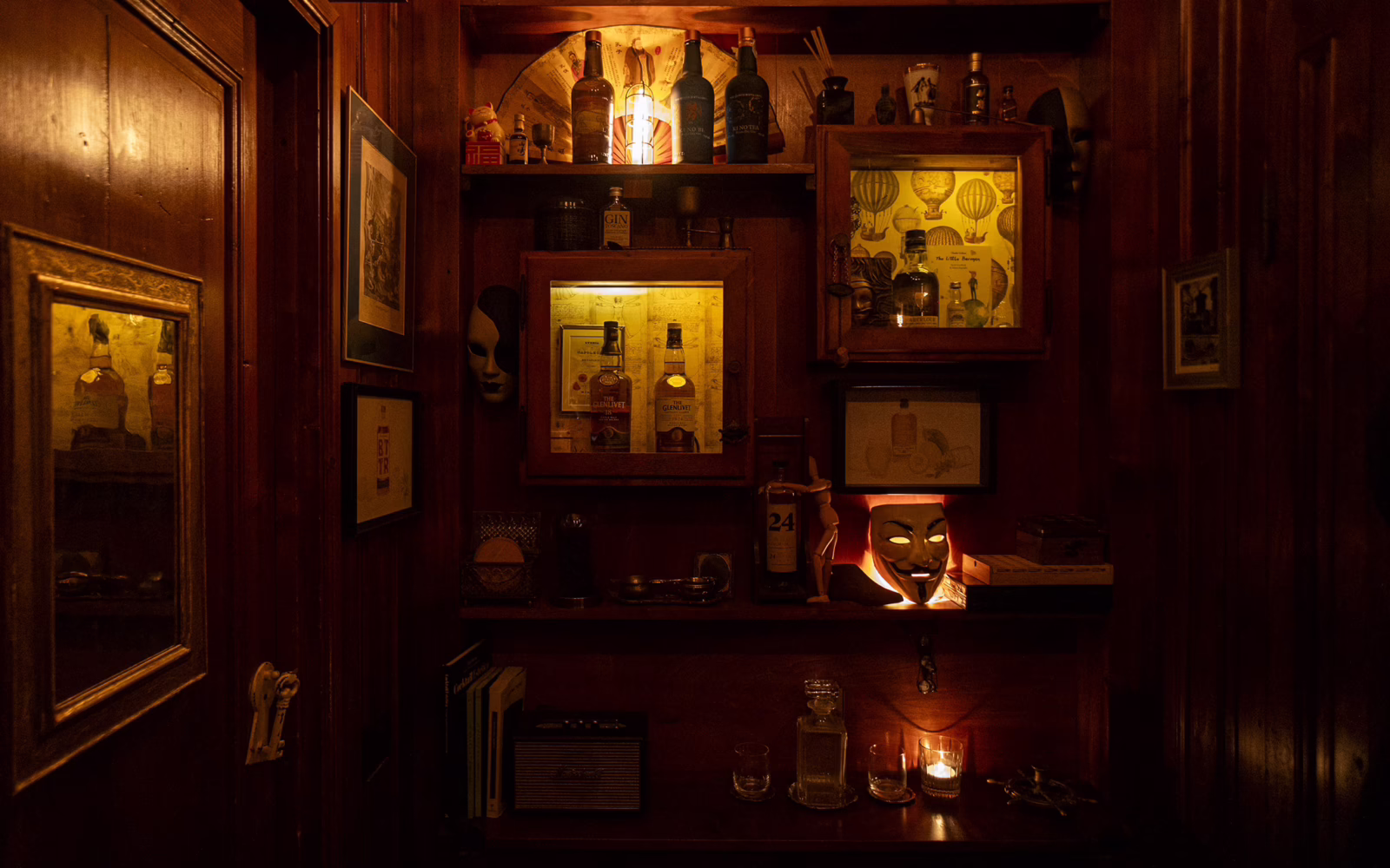 Bottles of spirits lined up behind the bar at Backdoor 43 in Milan.