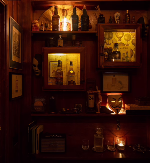 Bottles of spirits lined up behind the bar at Backdoor 43 in Milan.