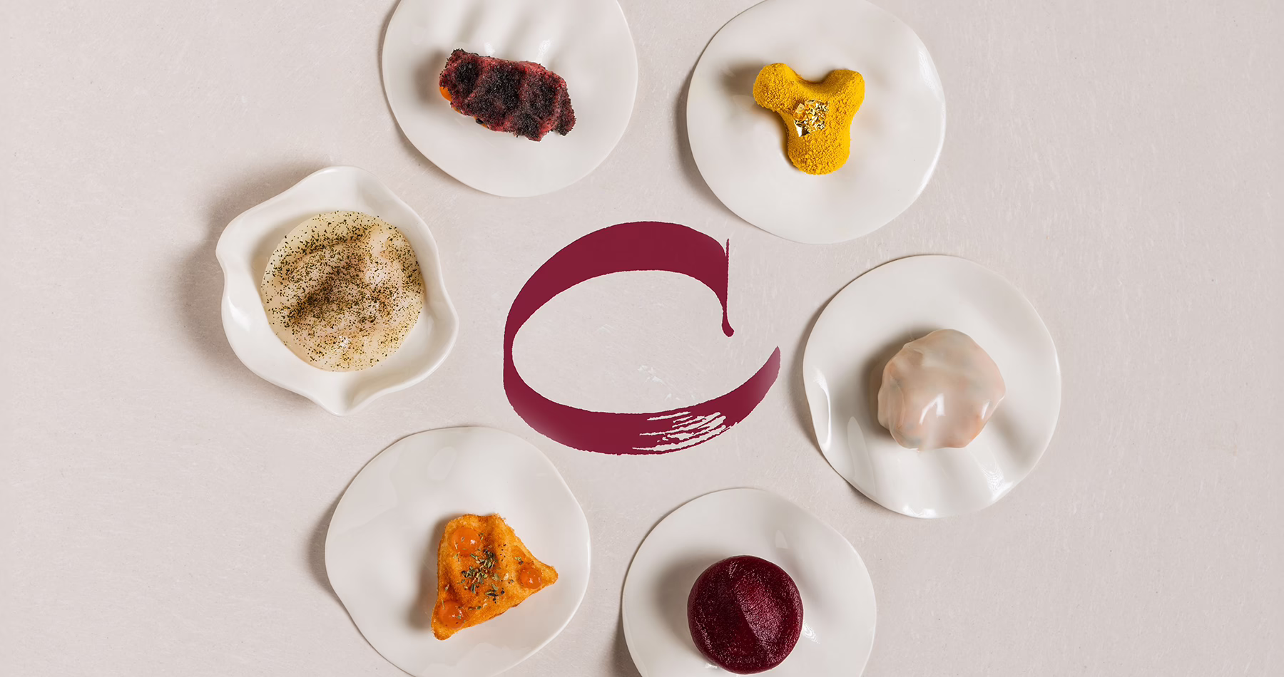 Six assorted bite-sized creations presented on a single plate at Contraste restaurant in Milan.