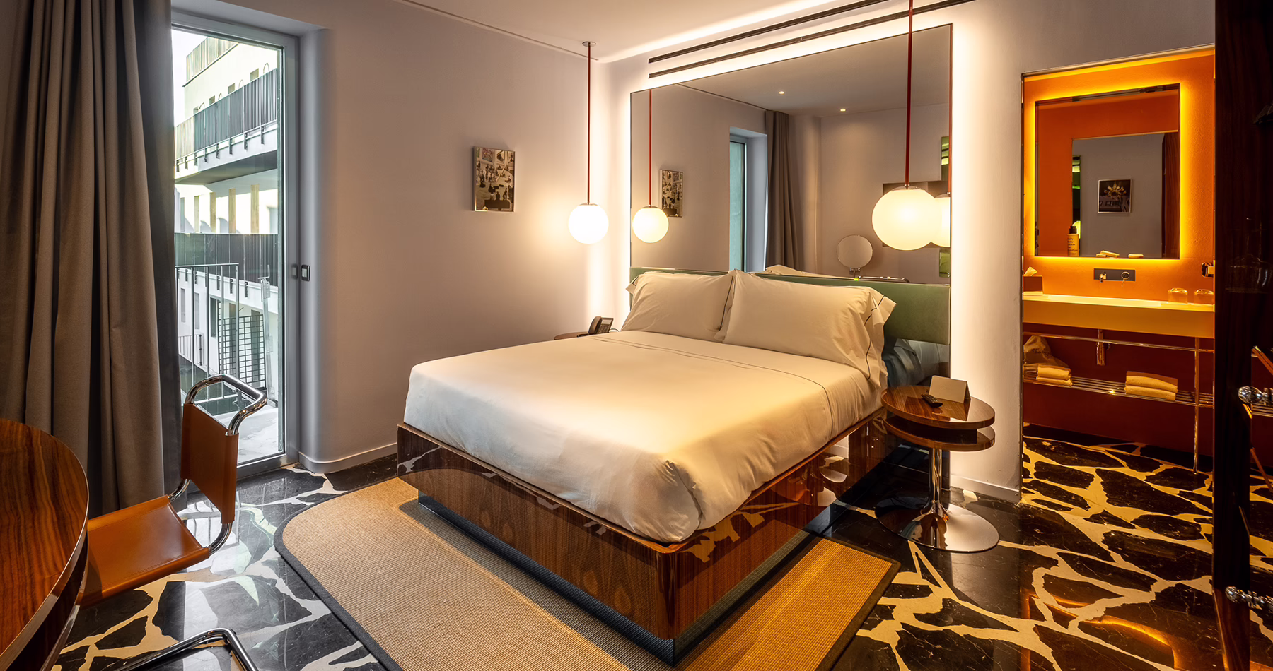 Colourful bedroom interior with bold furnishings at Hotel Calimala Milano