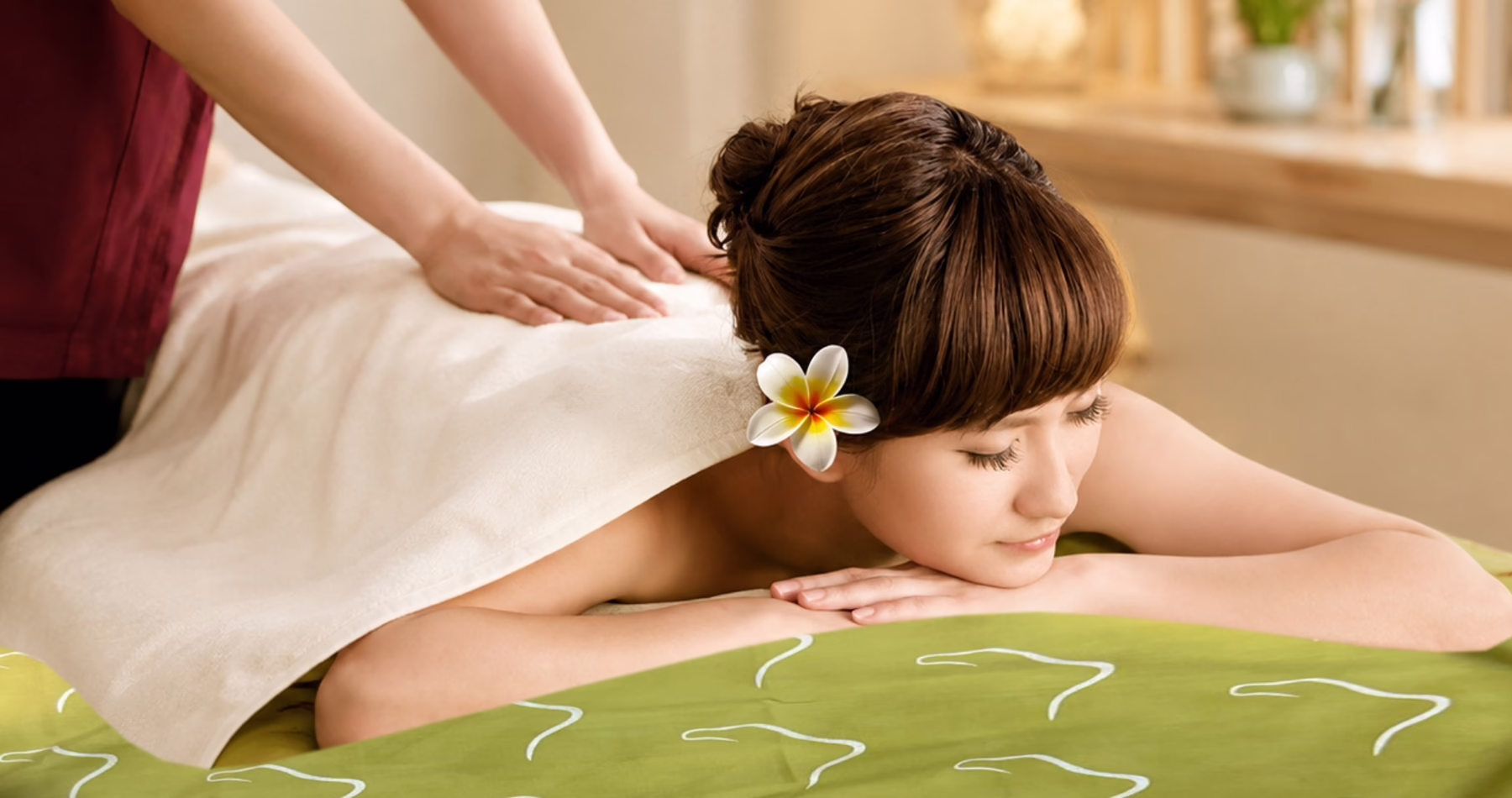 Guest receiving a body massage at Kenko Wellness Singapore
