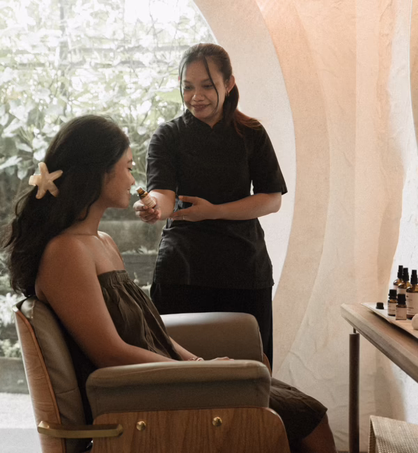Therapist guiding a guest through a sensory experience at SHOSAN Holistic Spa