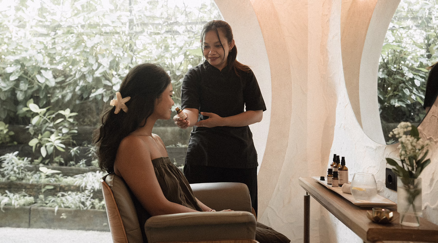 Therapist guiding a guest through a sensory experience at SHOSAN Holistic Spa