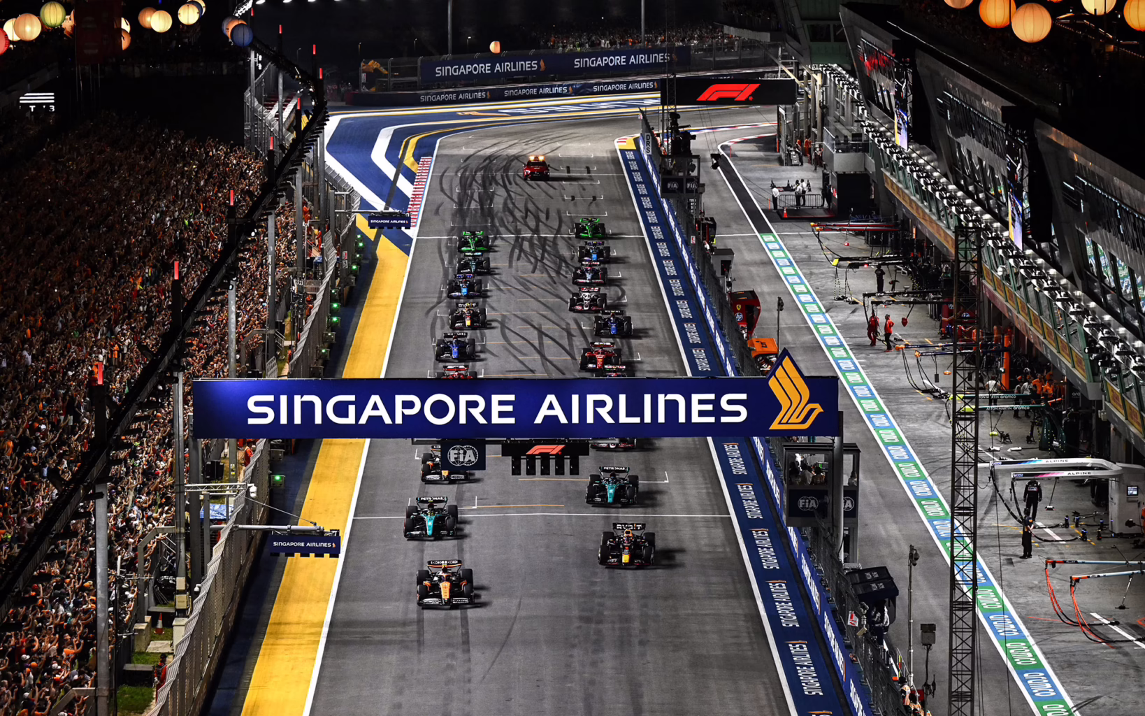 Formula 1 cars line up on the starting grid ahead of the Singapore Grand Prix.