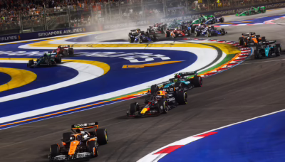 Formula 1 cars racing on the Marina Bay Street Circuit during the Singapore Grand Prix