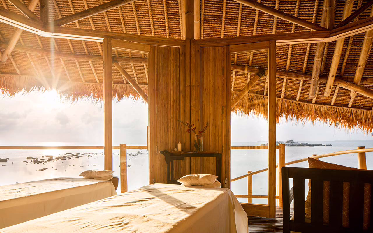 The Rock Spa nestled among granite boulders and tropical greenery on Cempedak Island, Indonesia
