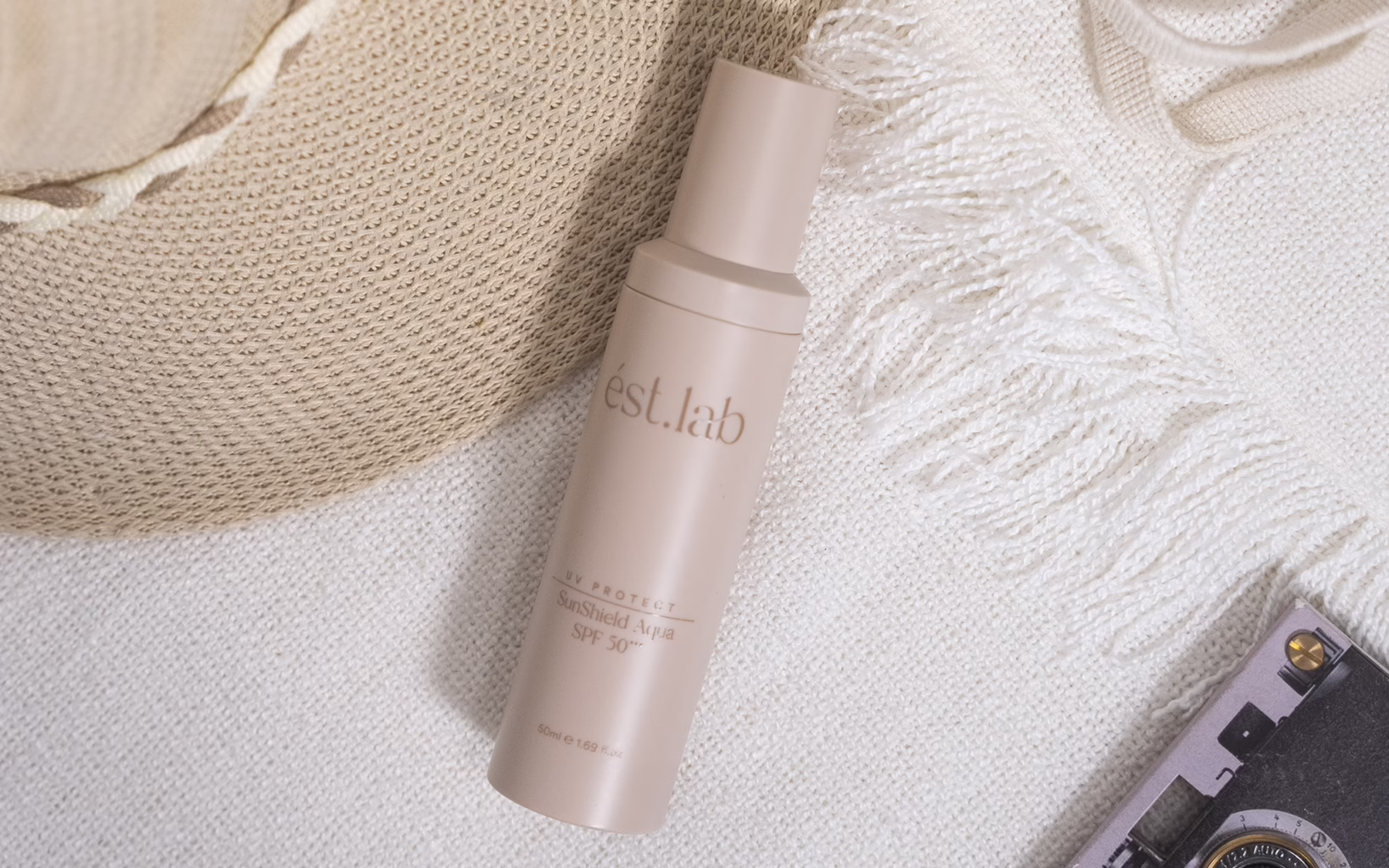 ést.lab SunShield Aqua SPF 50 in its refillable airless pump bottle