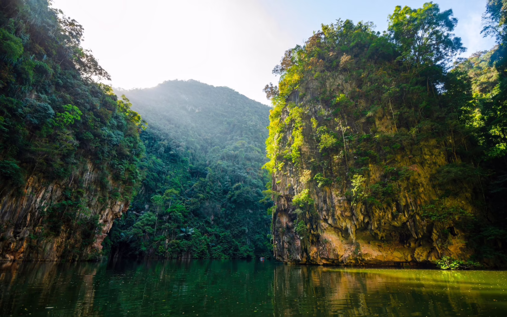 Ipoh’s Mirror Lake, surrounded by dramatic limestone cliffs and lush greenery