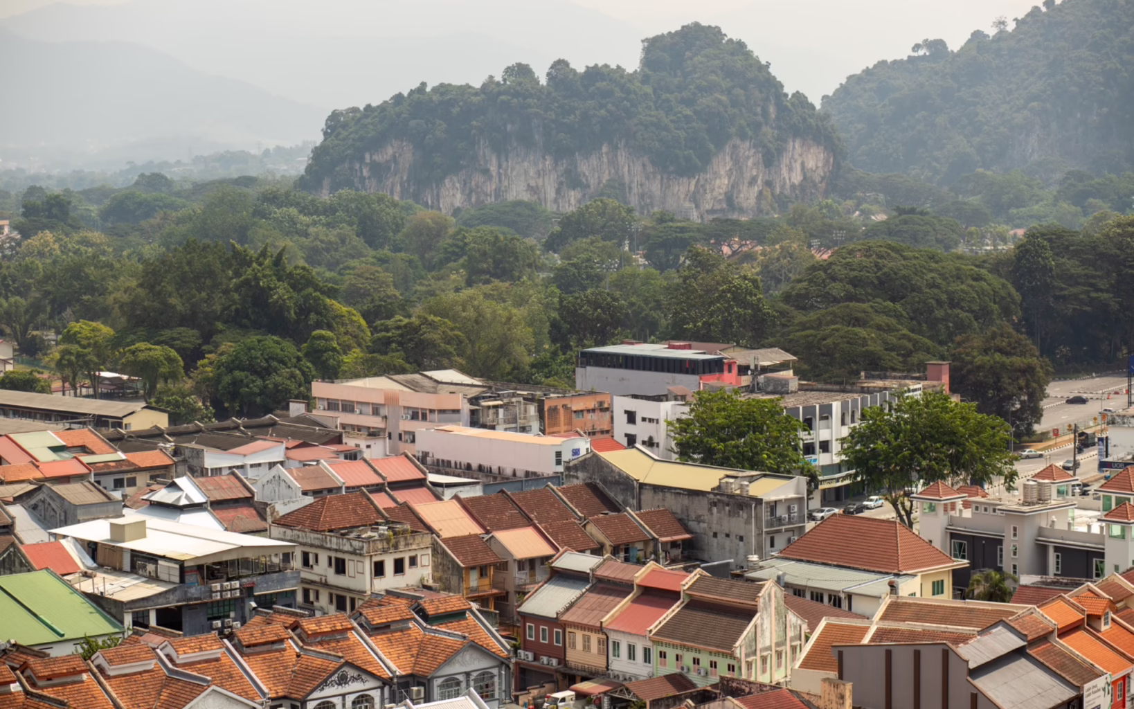 An aerial view of Ipoh, framed by the limestone hills of Perak