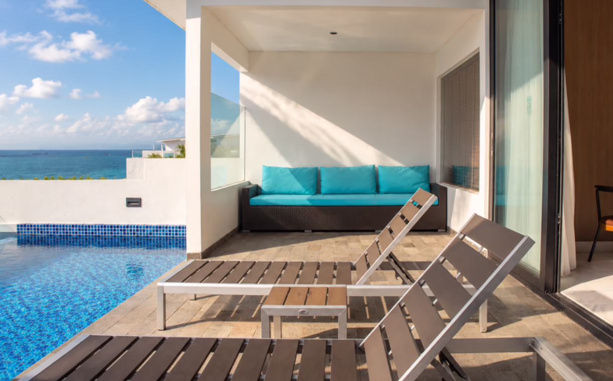Private pool and sun loungers on the terrace of a studio at Montigo Resorts Nongsa in Batam, overlooking the Singapore Strait.