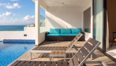 Private pool and sun loungers on the terrace of a studio at Montigo Resorts Nongsa in Batam, overlooking the Singapore Strait.