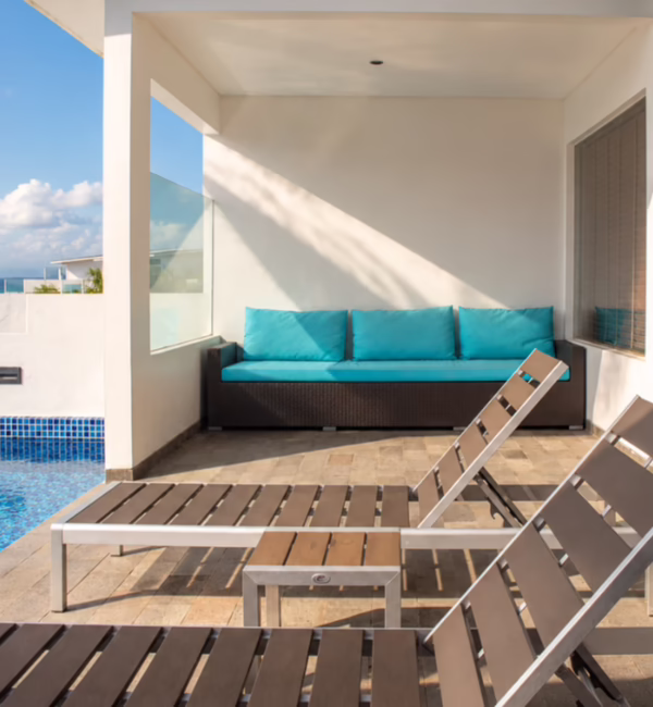 Private pool and sun loungers on the terrace of a studio at Montigo Resorts Nongsa in Batam, overlooking the Singapore Strait.