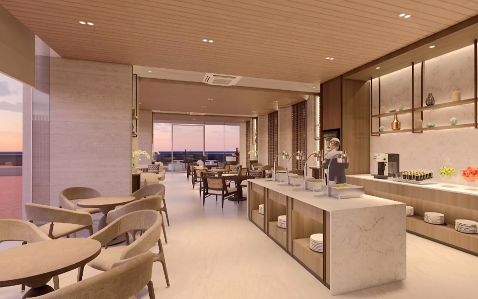 Executive lounge at Balmoral Tower, Opus Bay in Batam, featuring contemporary seating, a buffet counter and floor-to-ceiling windows overlooking the waterfront.