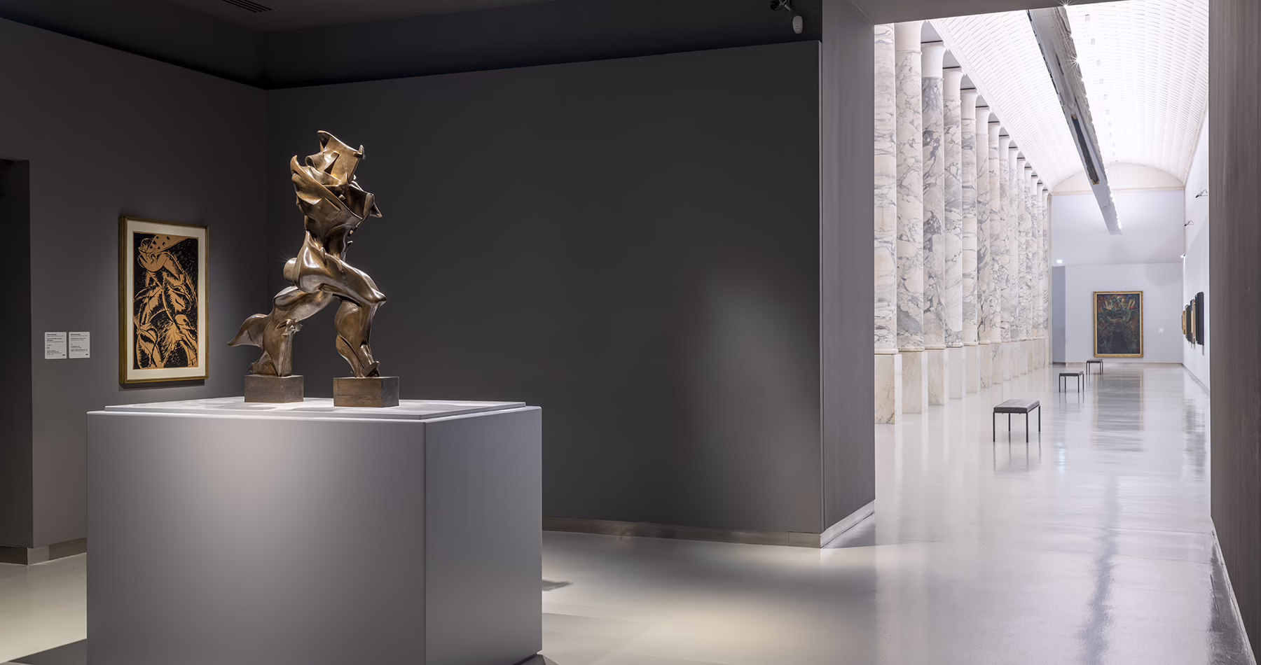 Futurist artworks and sculpture displayed inside the Museo del Novecento in Milan.