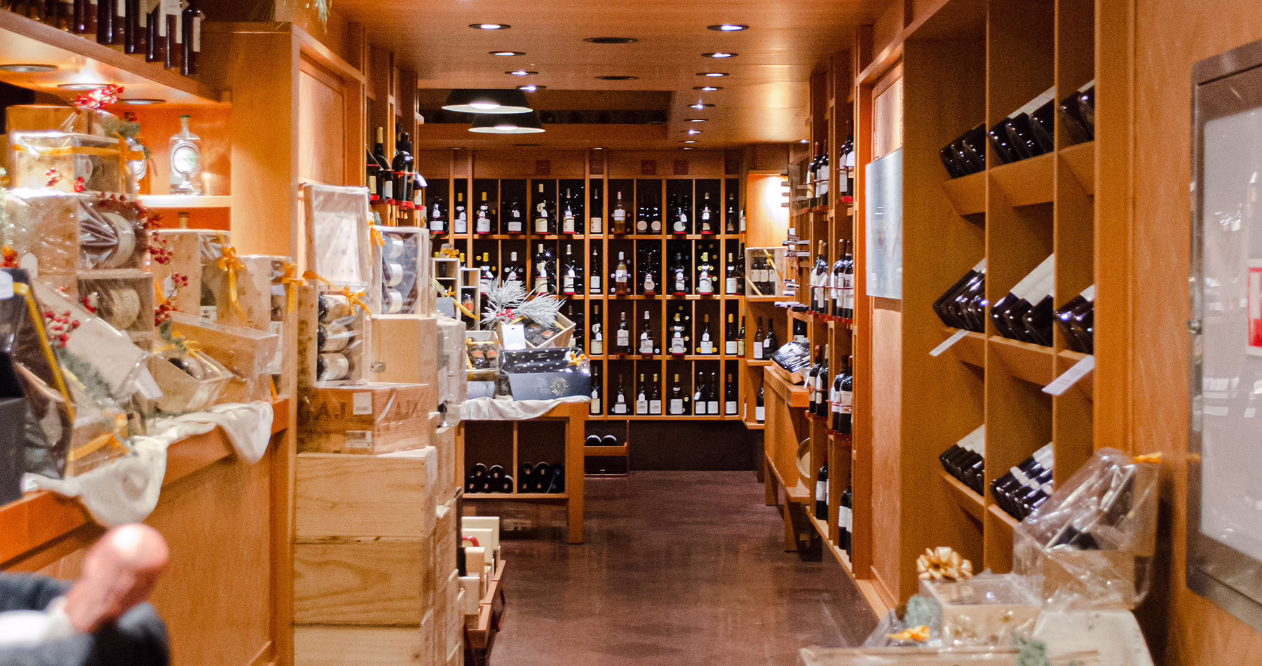 Shelves lined with Italian and international wines inside Peck’s enoteca in Milan.