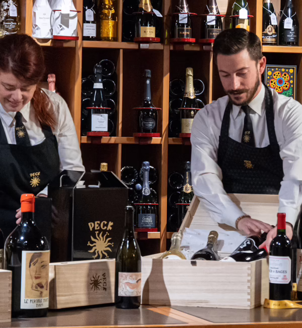 Peck staff arranging bottles in the wine cellar at the Via Spadari flagship in Milan.