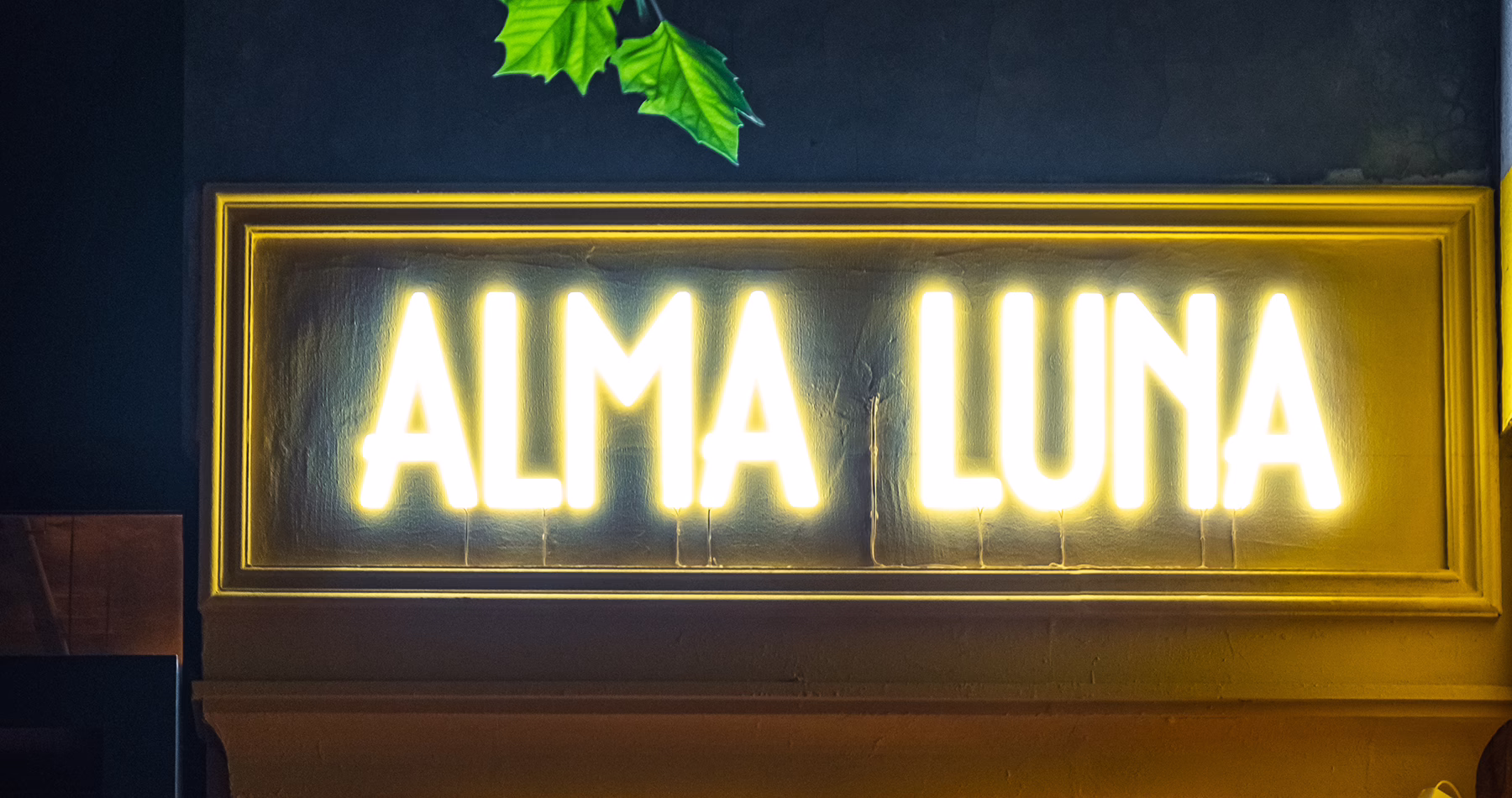 Illuminated Alma Luna sign at the Shanghai cocktail bar founded by bartender Yao Lu.