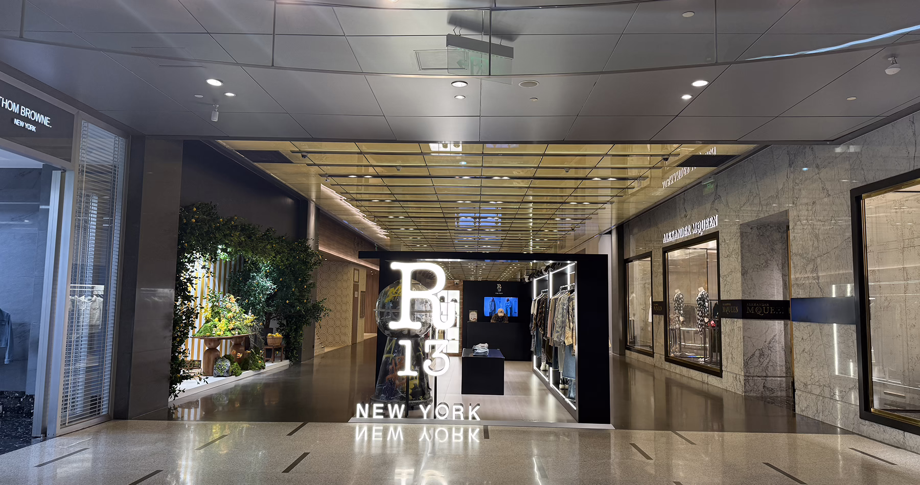 Designer shopping area at Reel Shanghai, featuring the entrances to Polo Ralph Lauren and Alexander McQueen boutiques.